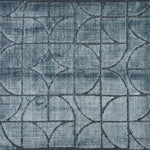 Handknotted rug sample with a tonal steel blue geometric motif.