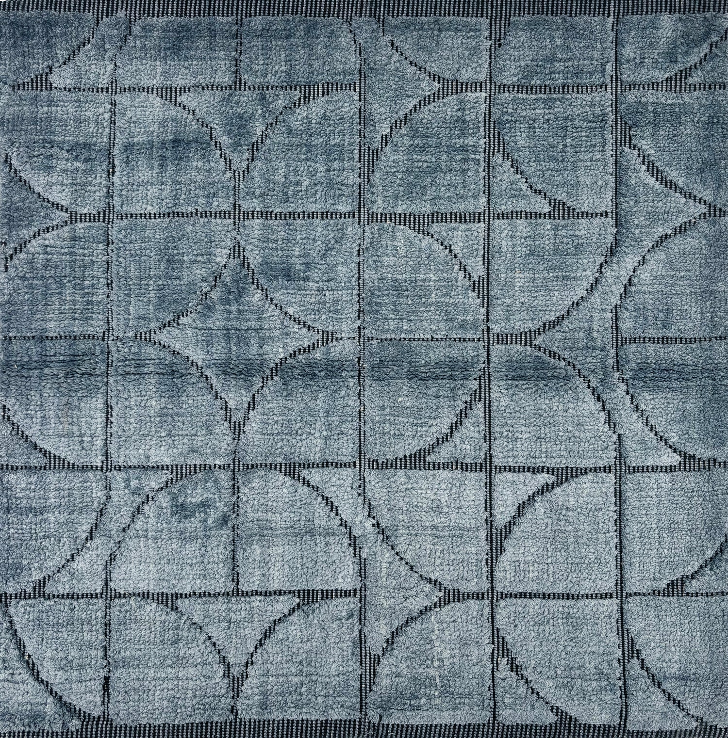 Handknotted rug sample with a tonal steel blue geometric motif.