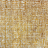 Handknotted rug sample in a textural blend of amber and ivory. 