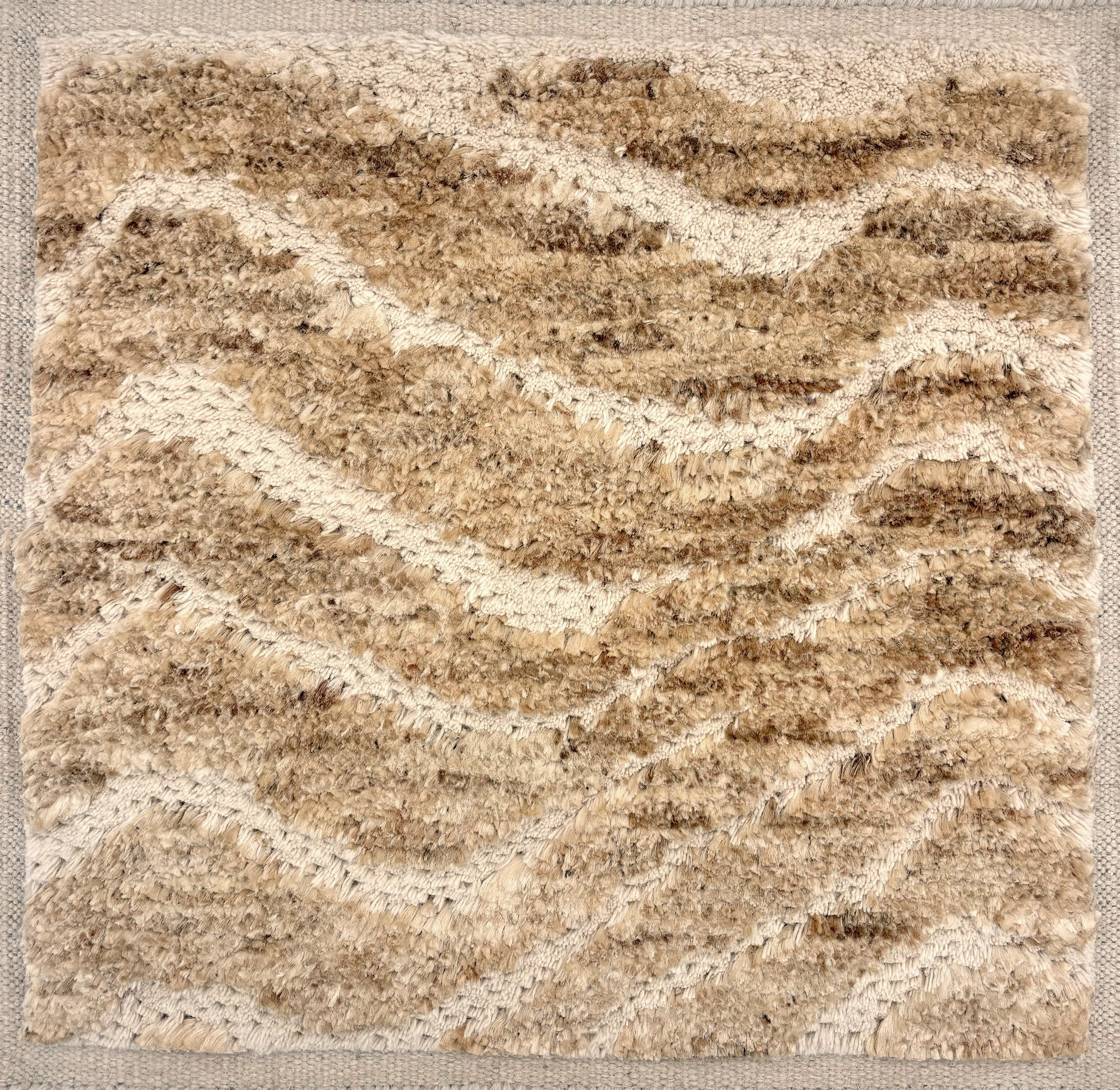 Handknotted Rug in the Moroccan style in a raisedwavy stripe in natural wool & jute. 