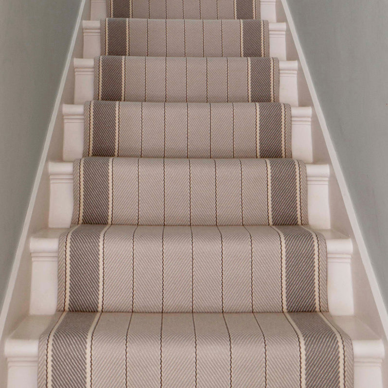 Striped flatweave runner in light grey an brown on white staircase