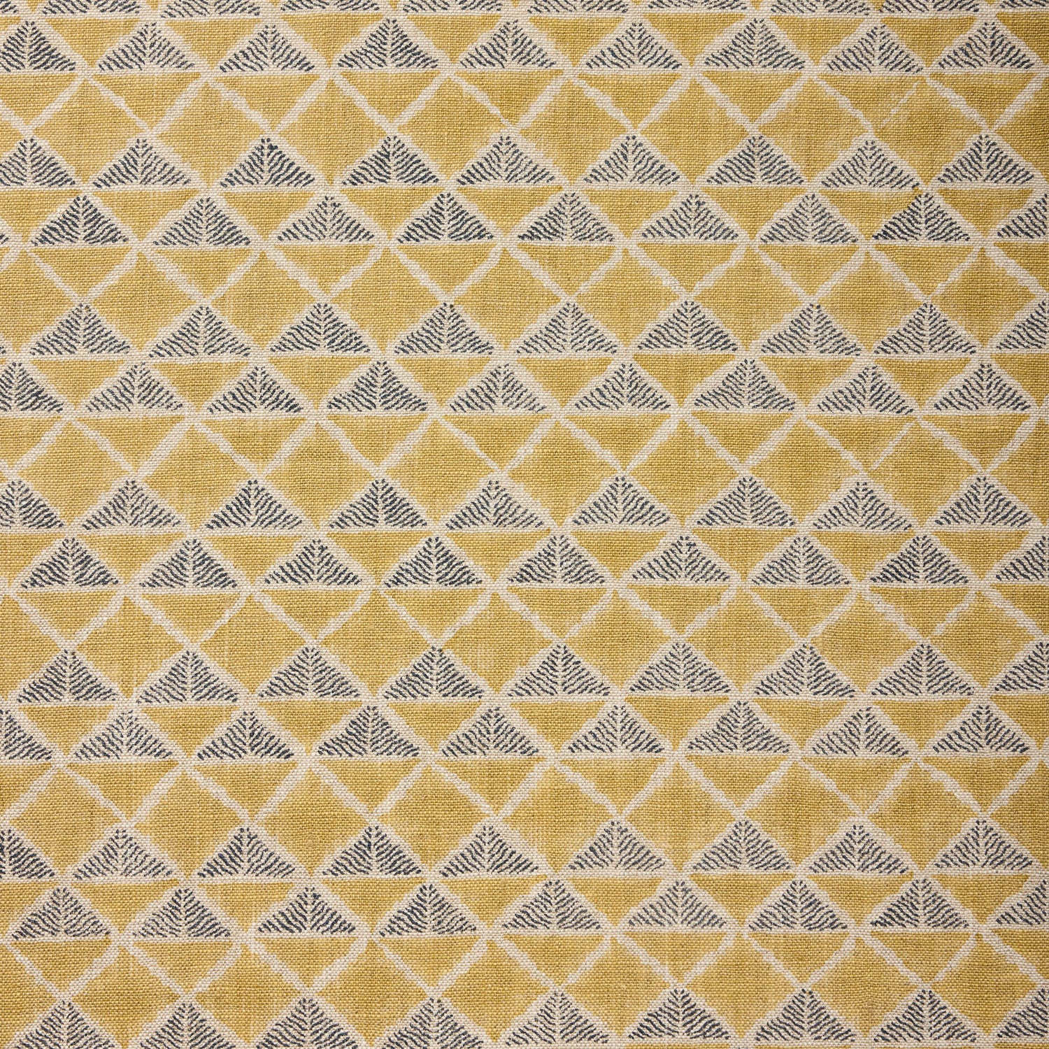 Fabric with a tan and navy blue geometric pattern.