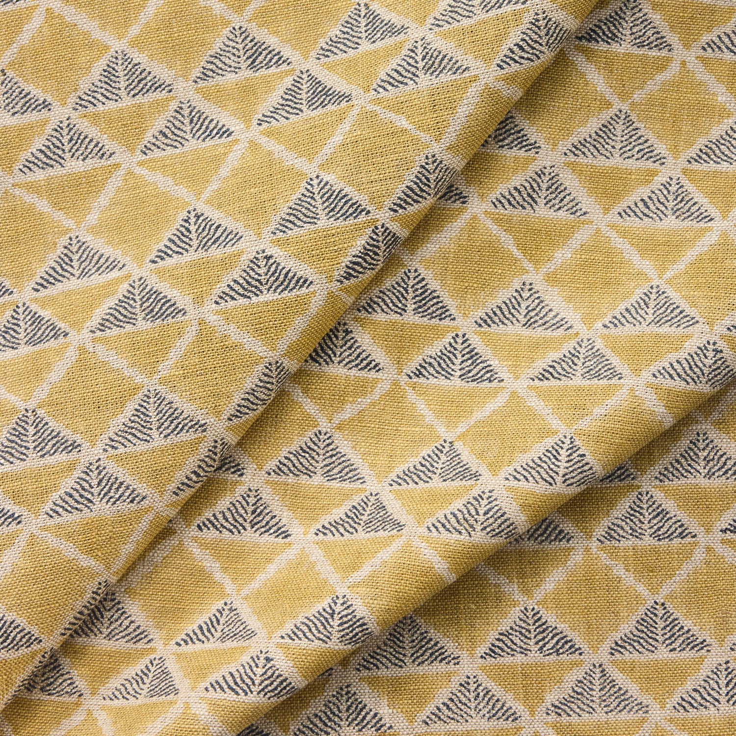 Draped fabric with a tan and navy blue geometric pattern