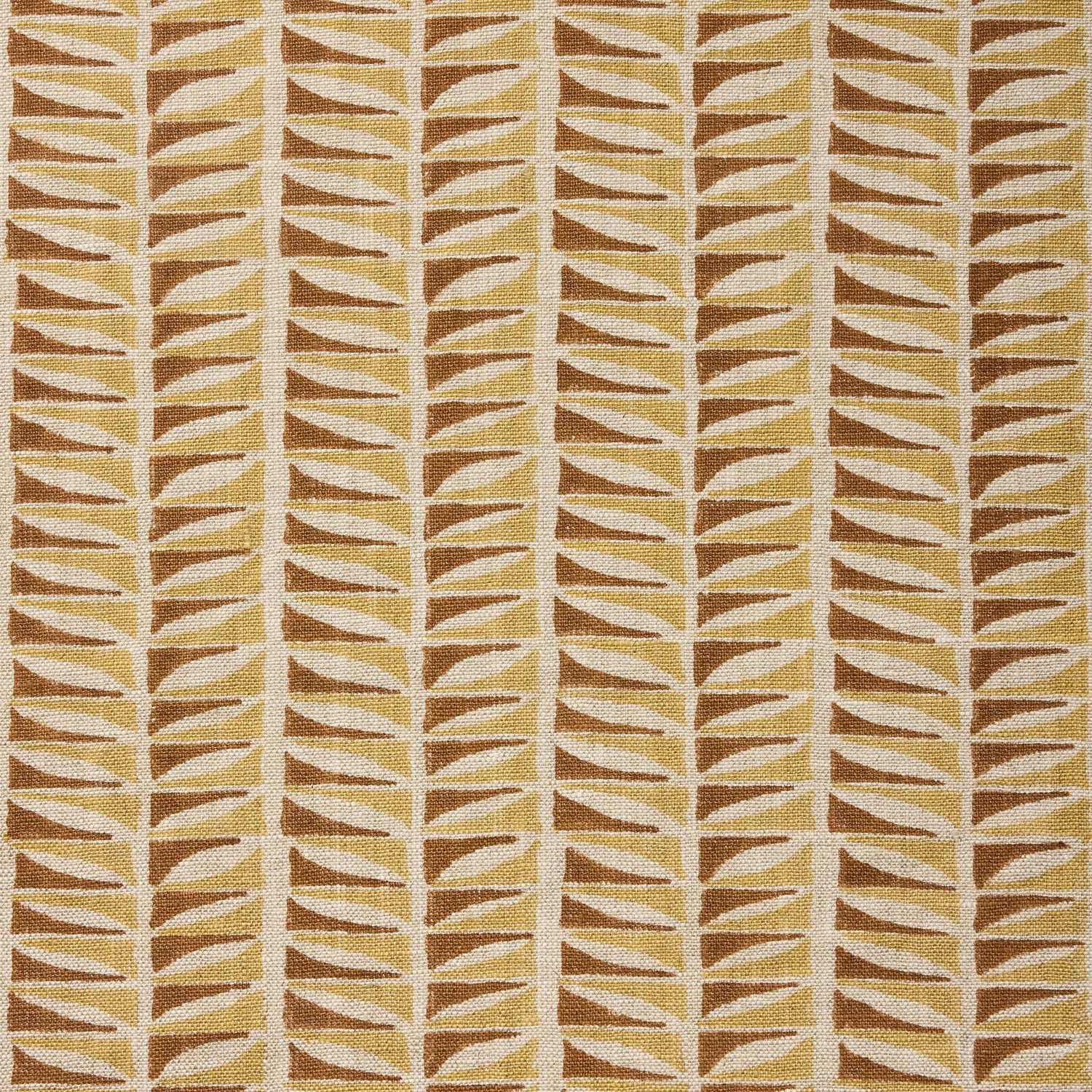 Close-up of fabric with a geometric leaf pattern in brown and beige.