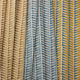 Three fabric swatches with geometric leaf pattern in blue, beige, and multicolor.