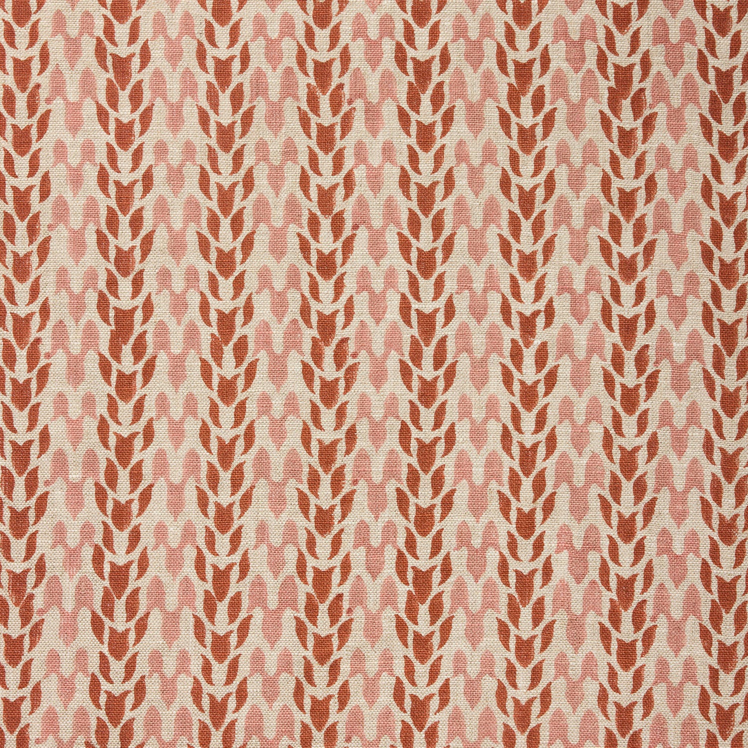 Fabric with a abstract leaf pattern in red and pink on a neutral background