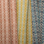 Three fabric swatches abstract leaf patterns in various colors.