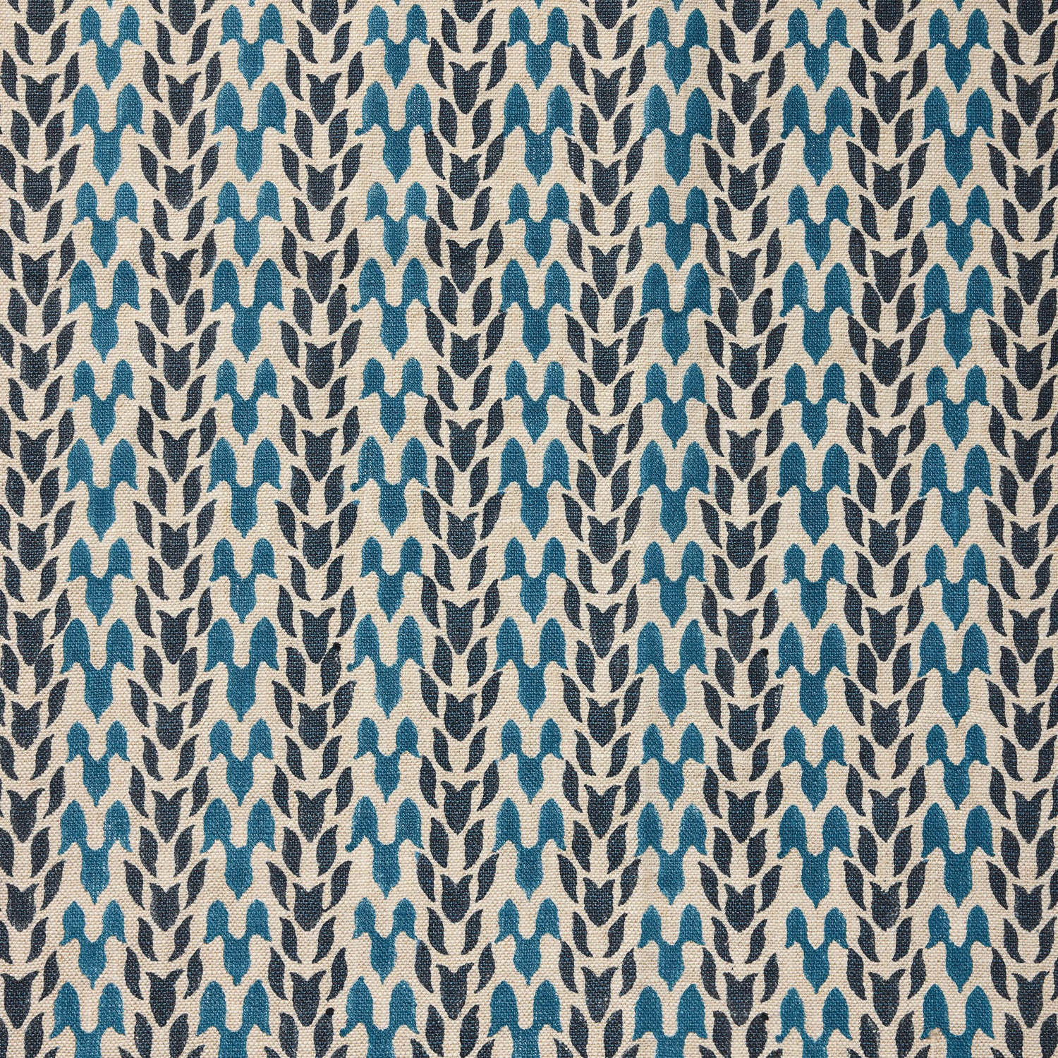 Close up of fabric with abstract leaf pattern in shades of blue. 