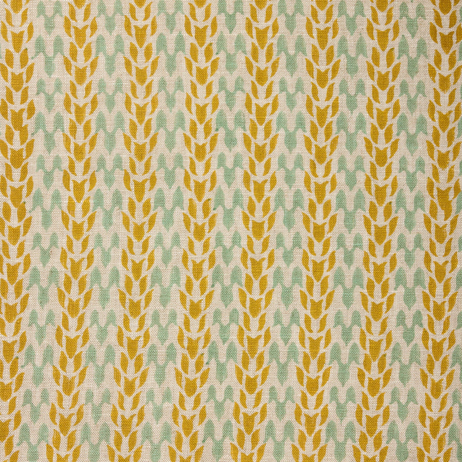 Textile pattern with yellow and green design on a fabric background