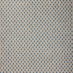 Textile pattern with blue and beige diamonds on a textured background
