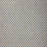 Textile pattern with blue and beige diamonds on a textured background