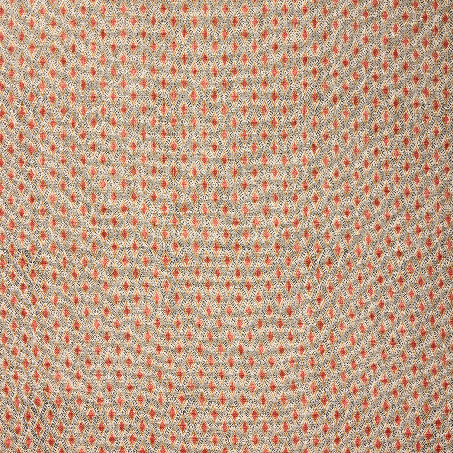 Textile pattern with small diamond shapes in red on a beige background