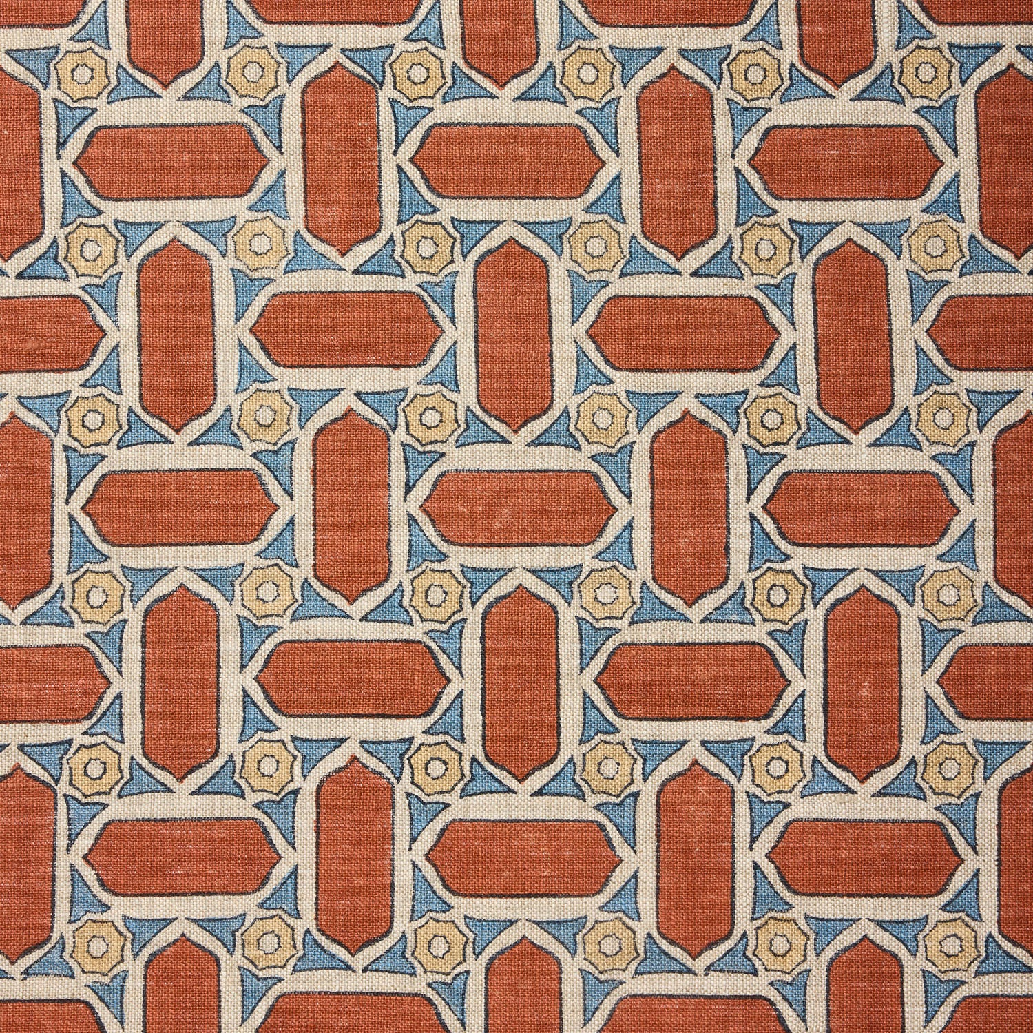 Fabric with geometric mosaic pattern of red, blue, and beige colors.