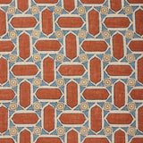 Fabric with geometric mosaic pattern of red, blue, and beige colors.
