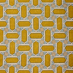 Close-up of fabric with geometric mosaic pattern in yellow and blue