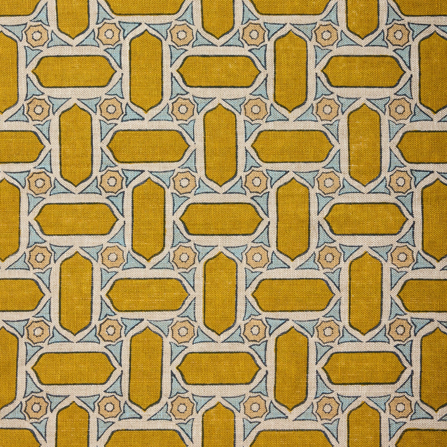 Close-up of fabric with geometric mosaic pattern in yellow and blue