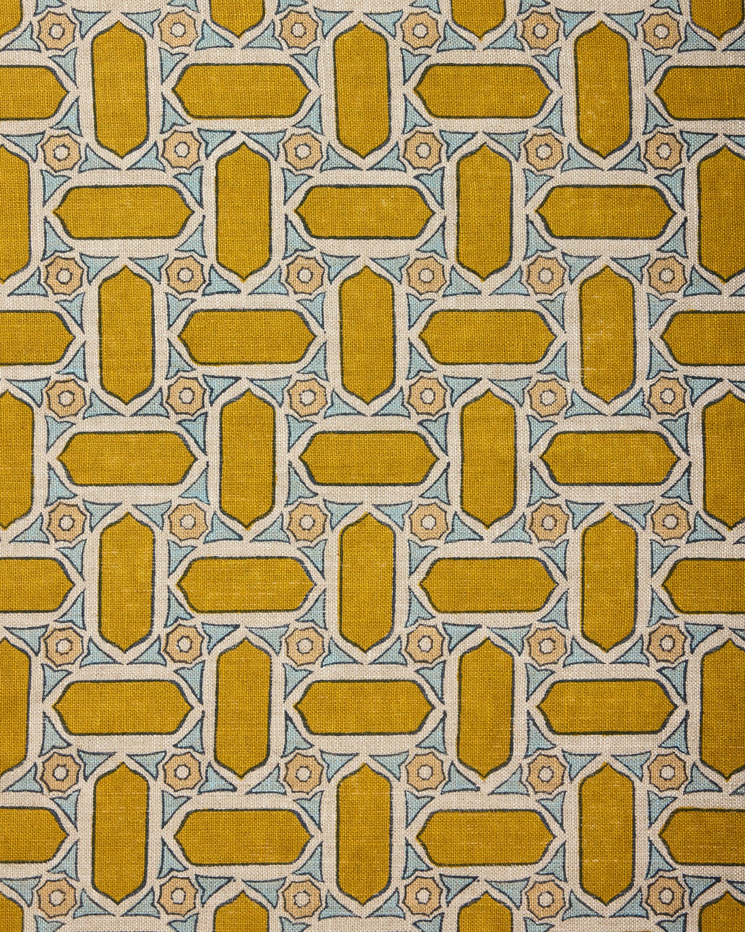 Close-up of fabric with geometric mosaic pattern in yellow and blue