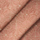 Draped fabric with geometric sun pattern  in clay pink and rust red.