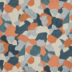 Woven fabric swatch in a painterly geometric pattern in shades of blue, cream and burnt orange.