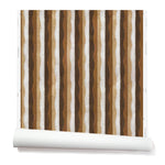 Partially unrolled wallpaper in a curvy hand-painted stripe pattern in shades of brown, tan and white.