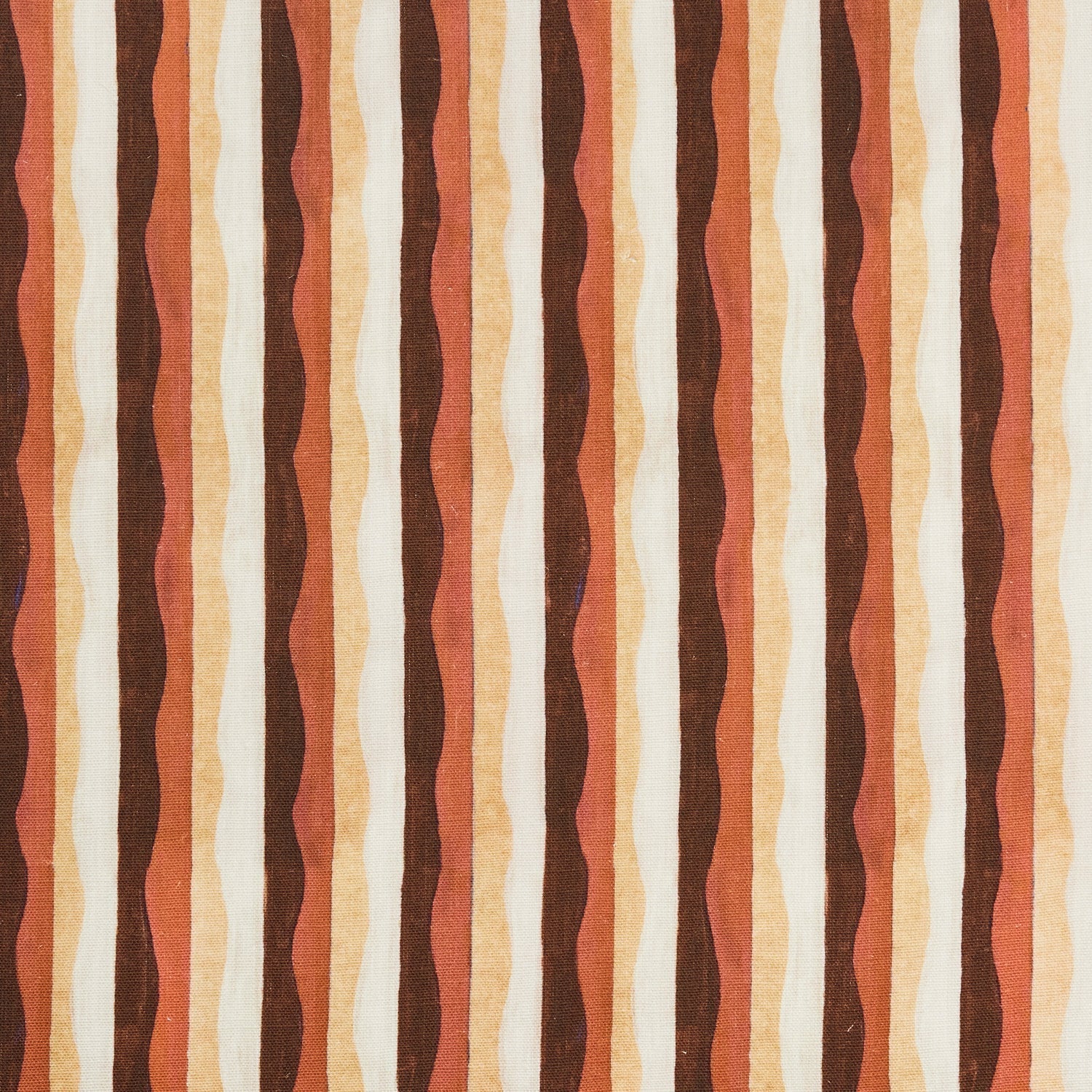 Woven fabric swatch in a curvy hand-painted stripe pattern in shades of brown, gold, rust and white.