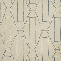 Woven fabric swatch in a repeating curvolinear print in navy on a tan field.