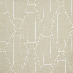 Woven fabric swatch in a repeating curvolinear print in white on a cream field.