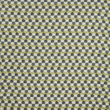 Woven fabric swatch in a repeating mosaic print in shades of green and gray-blue on a tan field.