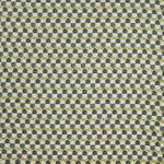 Woven fabric swatch in a repeating mosaic print in shades of green and gray-blue on a tan field.