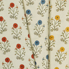 A group of draped woven fabrics, each in a different colorway of a painterly floral print. 