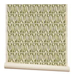 Partially unrolled wallpaper in an abstract tulip print in a repeating stripe on a sage field.