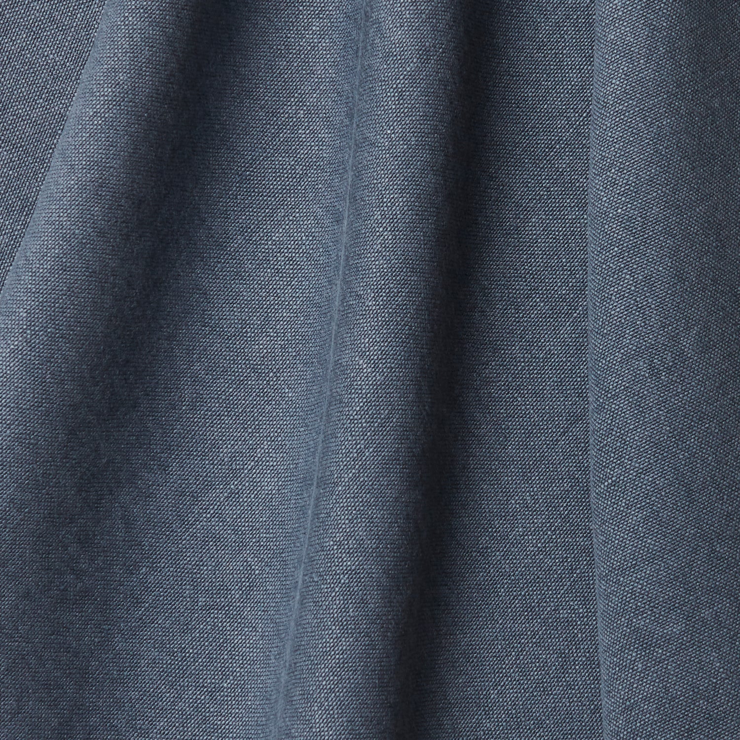 A draped swatch of linen fabric in a solid navy color.
