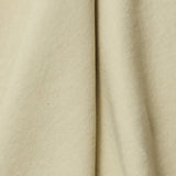 A draped swatch of linen fabric in a solid pale green color.