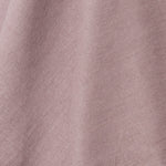 A draped swatch of linen fabric in a solid mauve color.