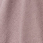 A draped swatch of linen fabric in a solid mauve color.
