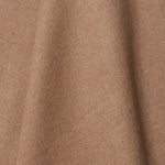 A draped swatch of linen fabric in a solid light brown color.