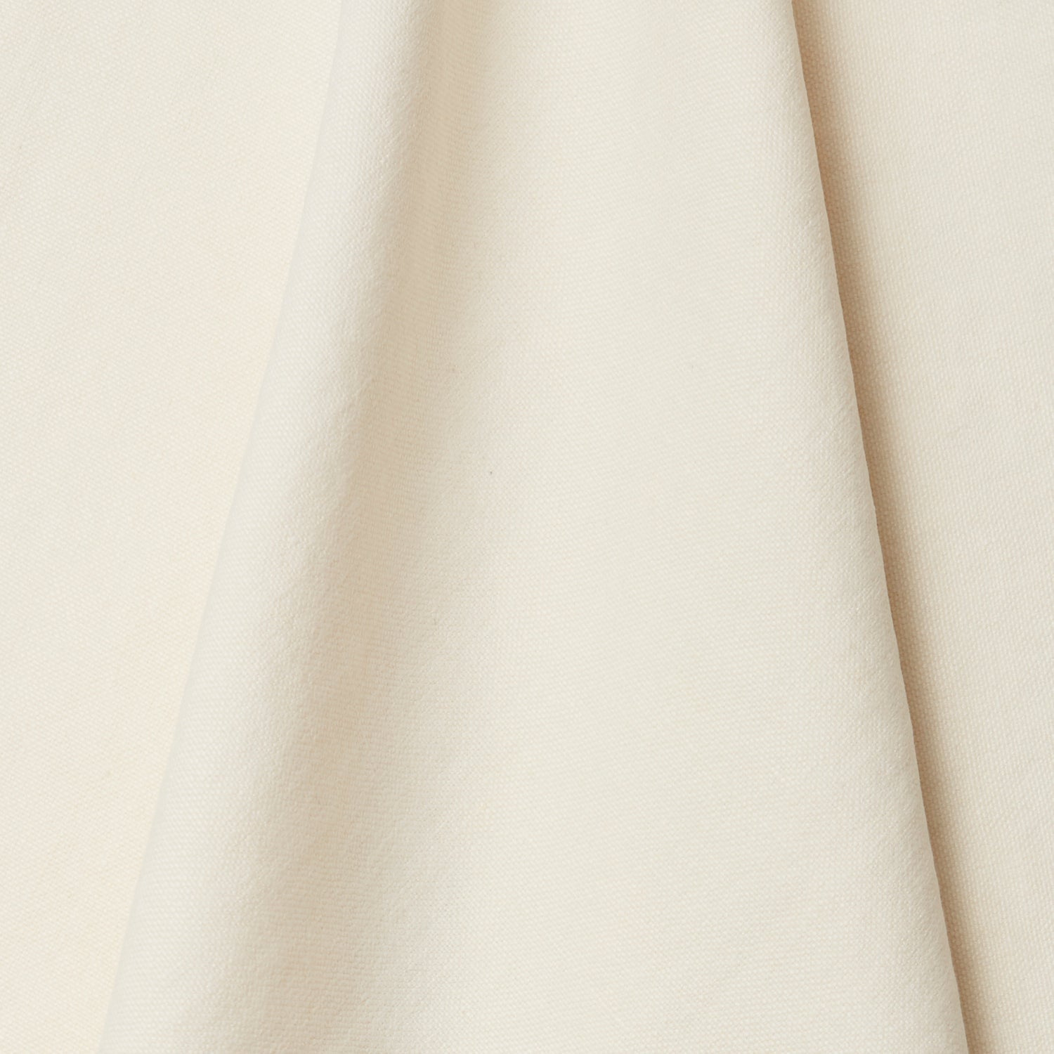 A draped swatch of linen fabric in a solid cream color.