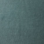 A swatch of old-world linen fabric in a solid dark green color.