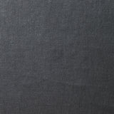 A swatch of old-world linen fabric in a solid dark gray color.