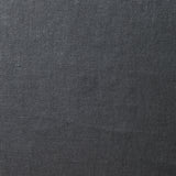 A swatch of old-world linen fabric in a solid dark gray color.