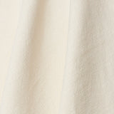 A draped swatch of old-world linen fabric in a solid white color.
