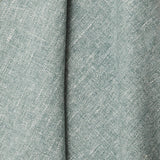 A draped swatch of blended linen fabric in a mottled light jade color.