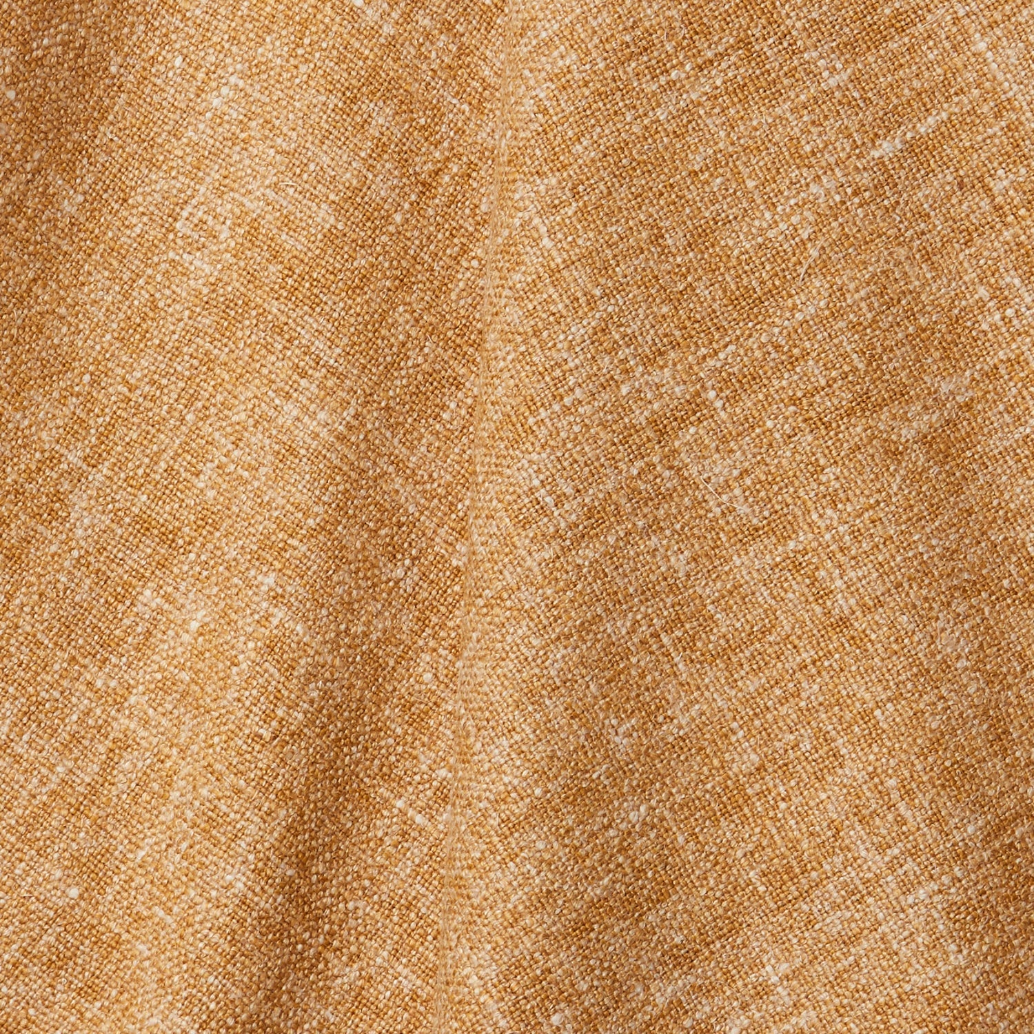 A draped swatch of blended linen fabric in a mottled mustard color.