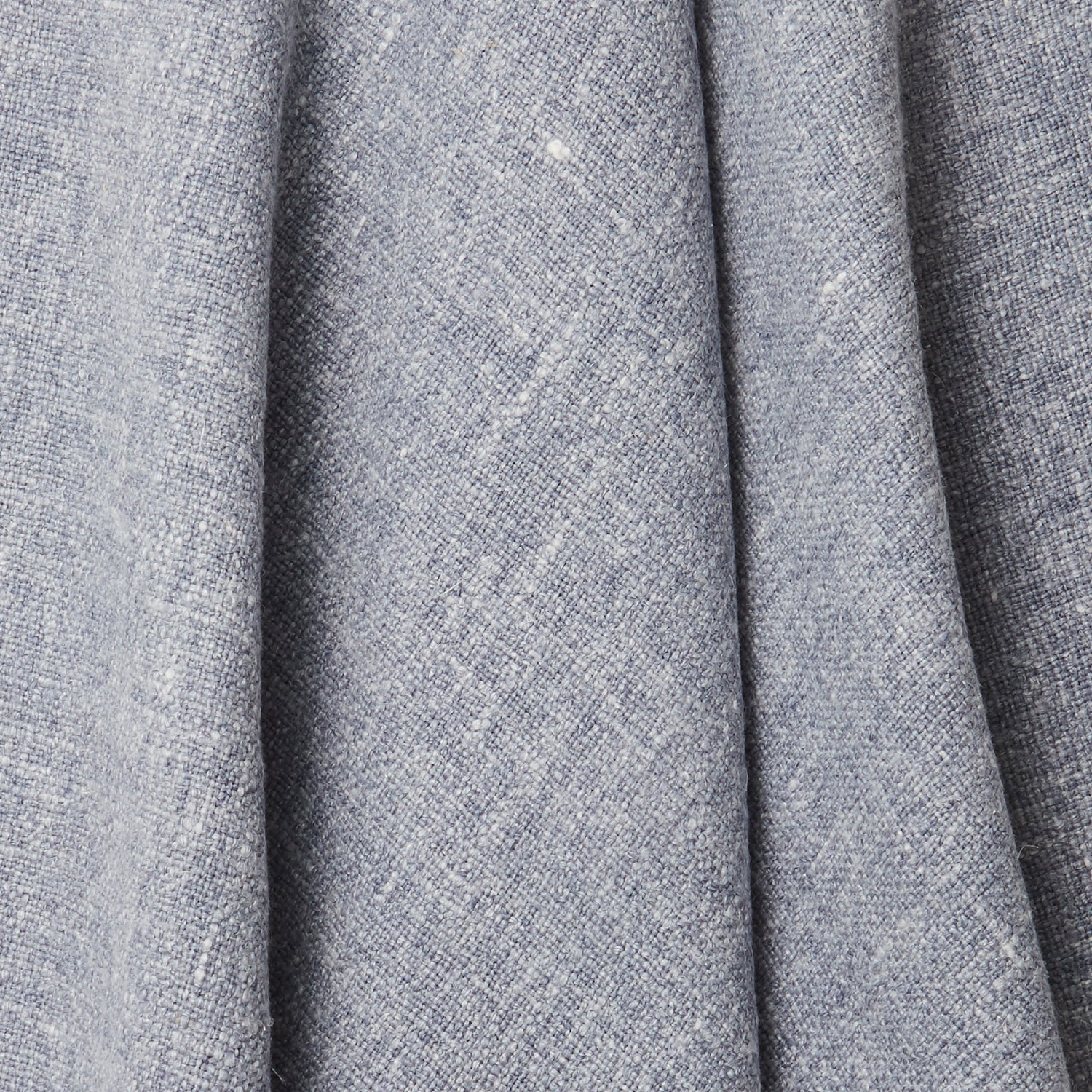 A draped swatch of blended linen fabric in a mottled light navy color.