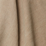 A draped swatch of blended linen fabric in a solid tan color.