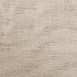 A swatch of linen fabric with a small-scale pattern of dark brown dashes on a tan background.
