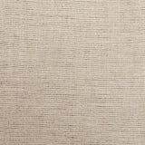 A swatch of linen fabric with a small-scale pattern of dark brown dashes on a tan background.