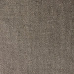A swatch of linen fabric with a small-scale pattern of diagonal stripes in dark brown and tan.