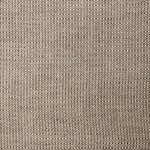 A swatch of linen fabric in a small-scale dotted pattern in tan and dark brown.
