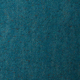 A swatch of blended linen-wool mix fabric in a flecked turquoise color.